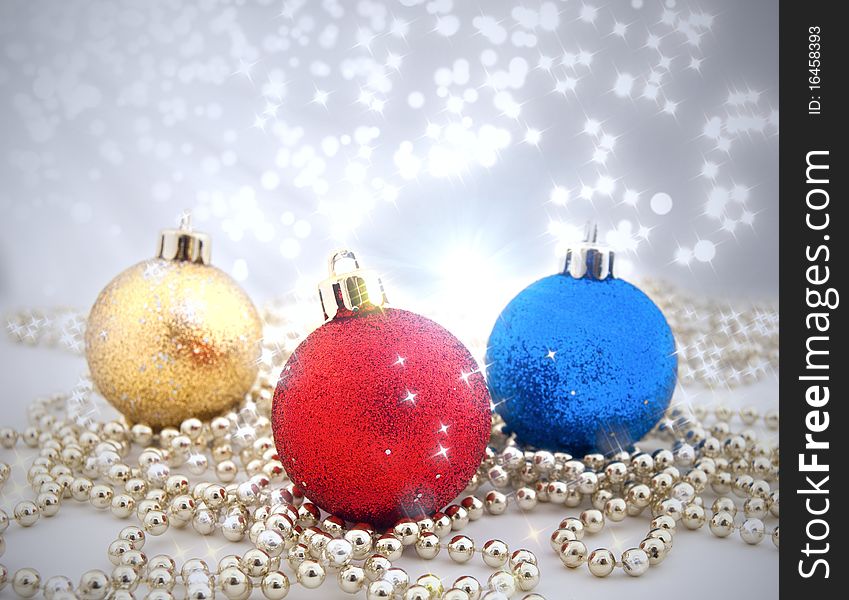 Sparkling Christmas decorations with a background from a bokeh and sparks