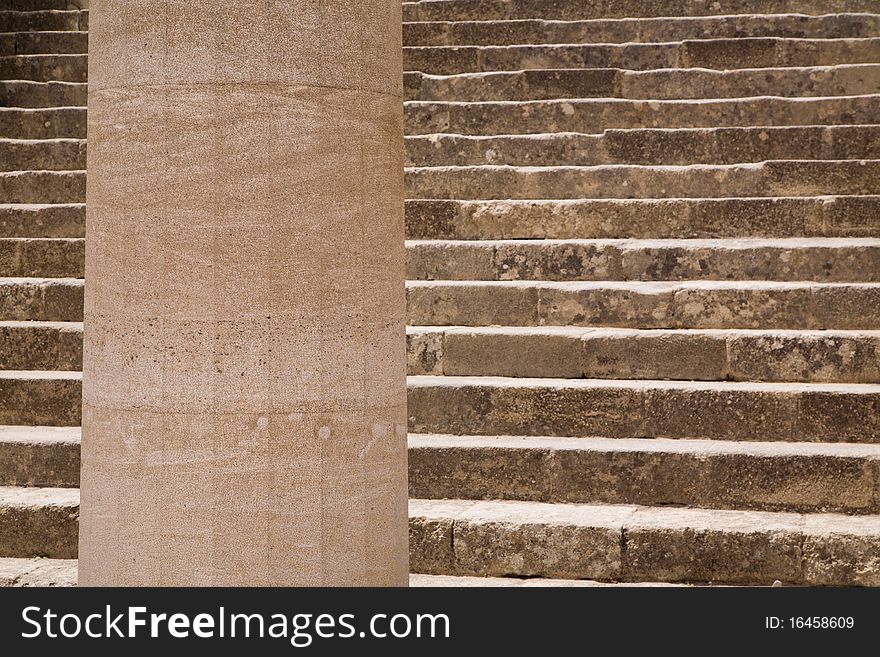 Close-up of the main stairs and a doric column in the Acropolis of Lindos, on the Greek island of Rhodes. Close-up of the main stairs and a doric column in the Acropolis of Lindos, on the Greek island of Rhodes.