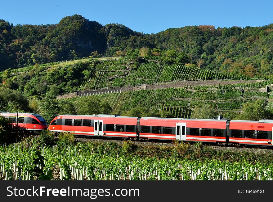 Red train green landscape in fall