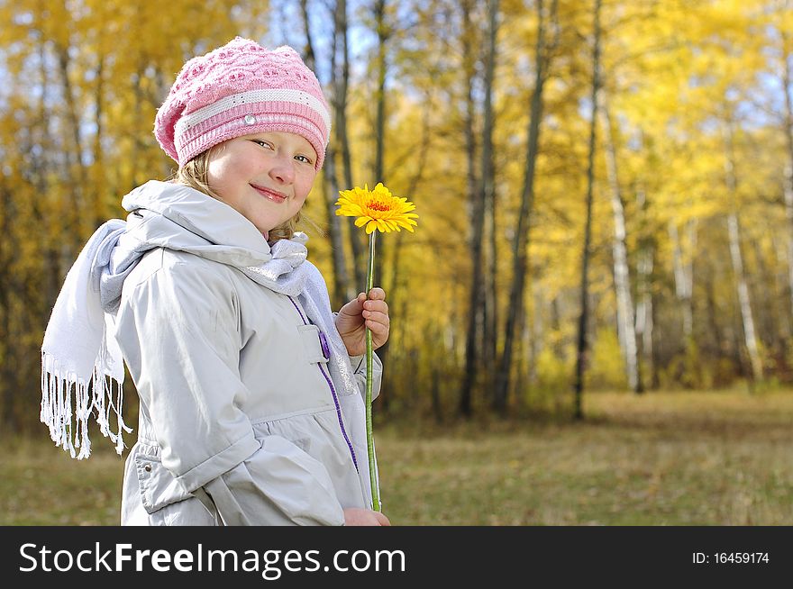 Little Girl With A Yellow Flower