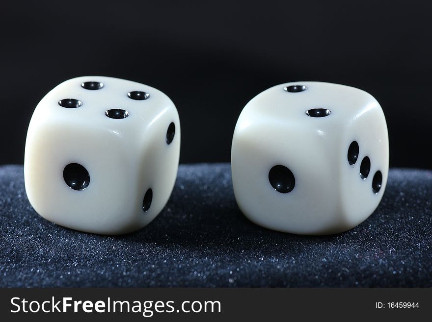 Detail of dice with black background