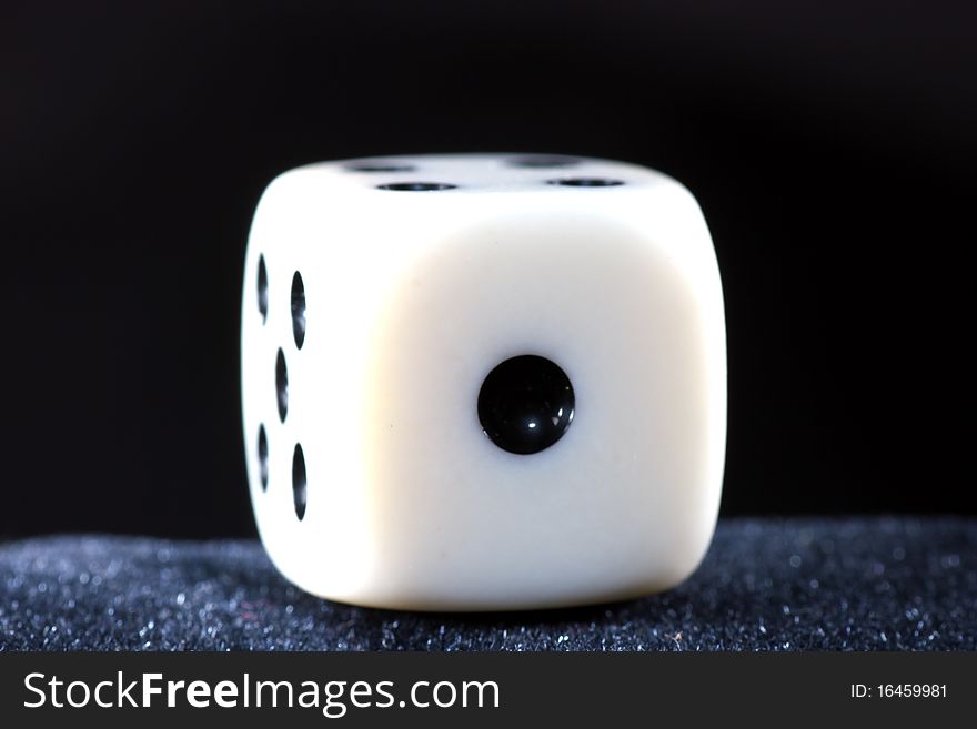 Detail of dice with black background