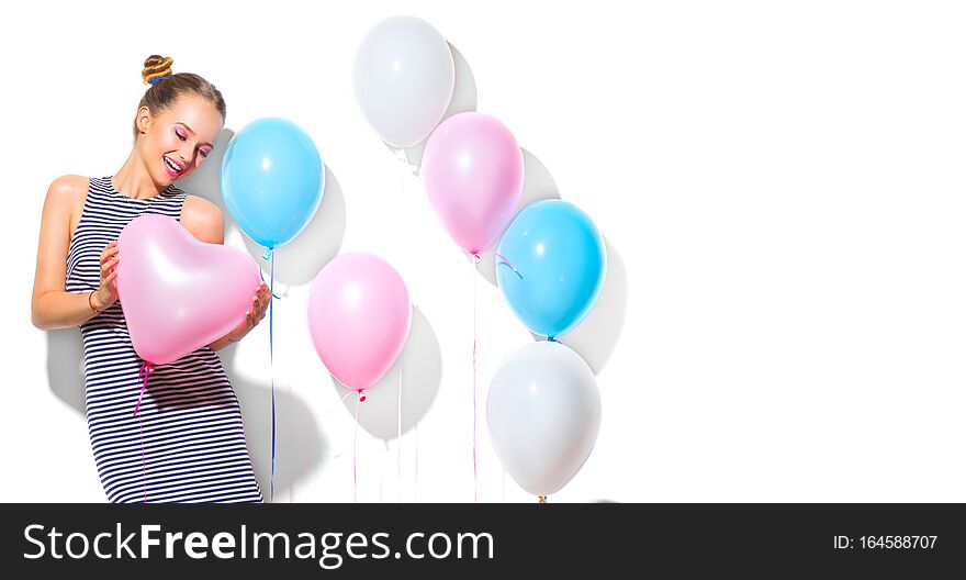 Beauty girl with colorful air balloons laughing over white background. Beautiful Happy Young woman on birthday holiday party