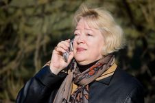 The Woman Talks On A Cellular Telephone Stock Photos The Woman Talks On A Cellular Telephone Stock Photos