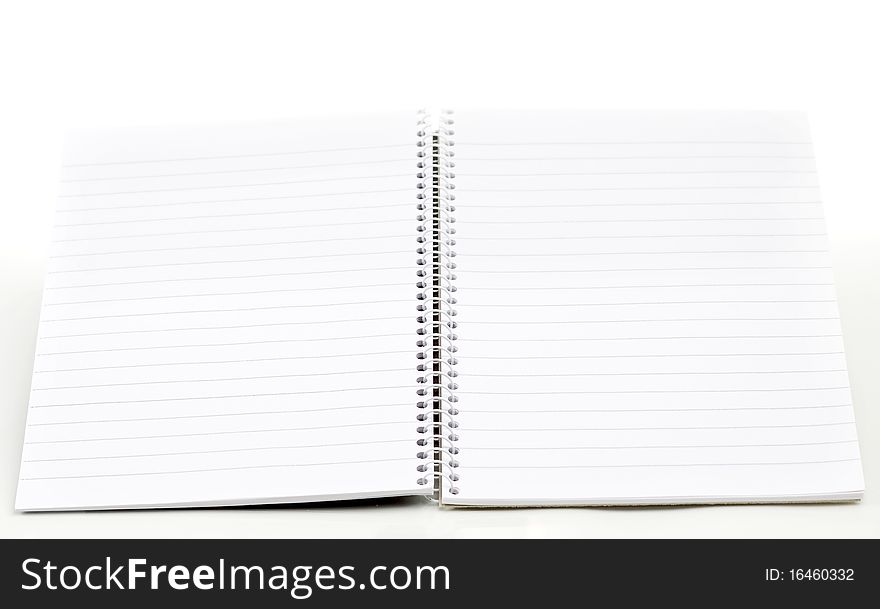 Open empty note book on white