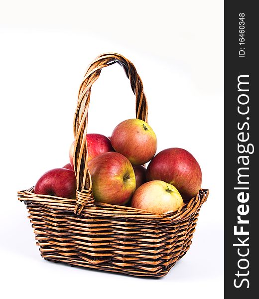 Wicker basket full of red organic apples. Wicker basket full of red organic apples