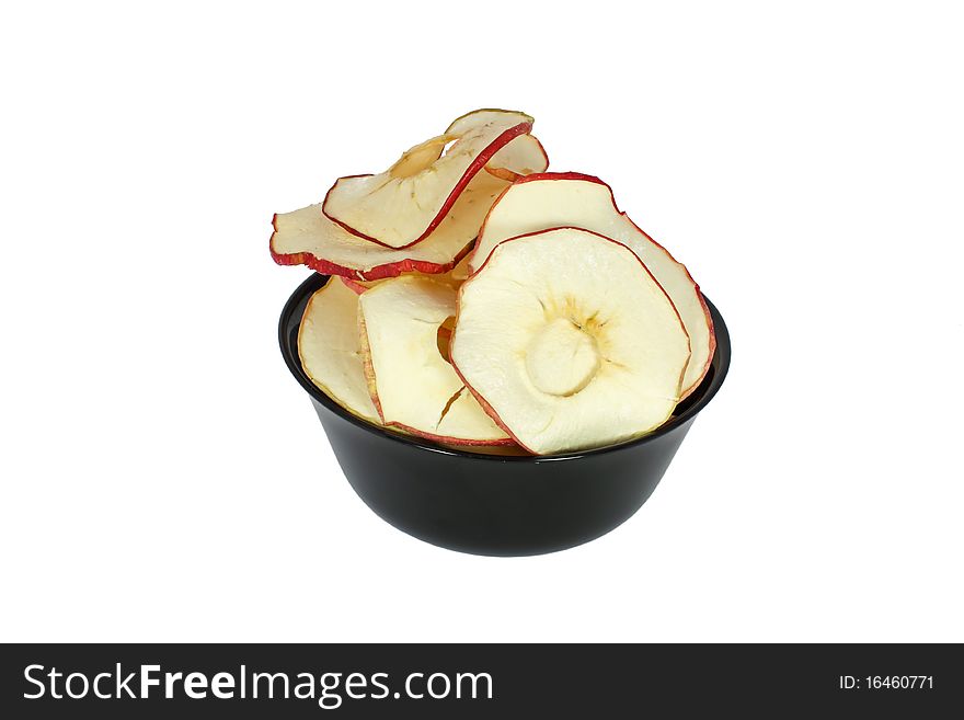 Apple crisp in black bowl isolated on white