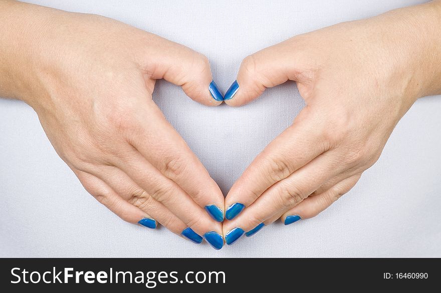 Woman hands - made heart symbol. Woman hands - made heart symbol