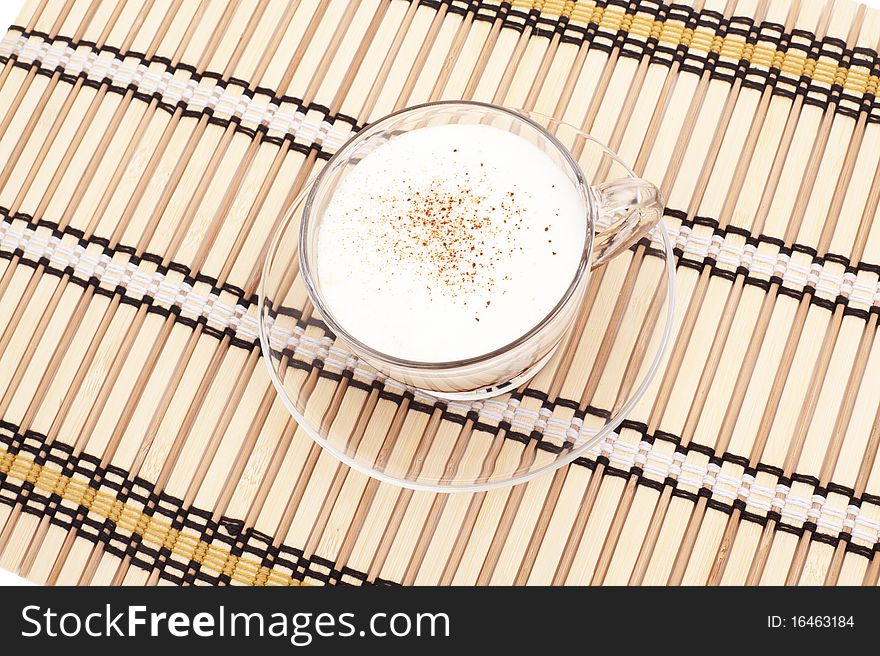 Cappuccino cup on bamboo mat