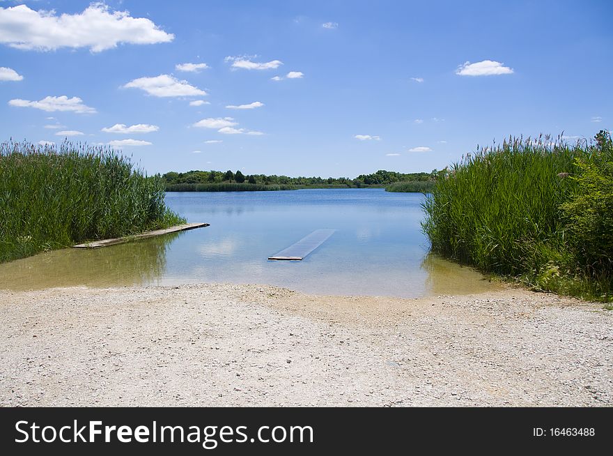 Summer Landscape Of Pond With Blue Sky