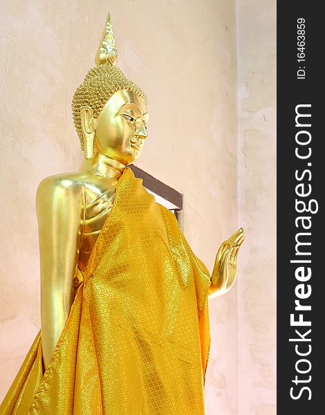 Standing golden Buddha in Ayutthaya province, Thailand. Standing golden Buddha in Ayutthaya province, Thailand.