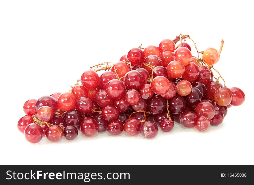 Red grapes on a white background are isolated. Red grapes on a white background are isolated.