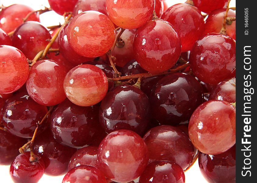 Red grapes on a white background are isolated. Red grapes on a white background are isolated.