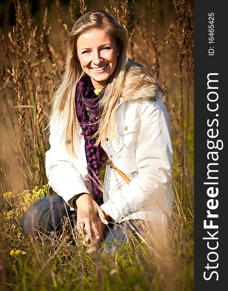 Caucasian young adult blond woman outdoor fall time