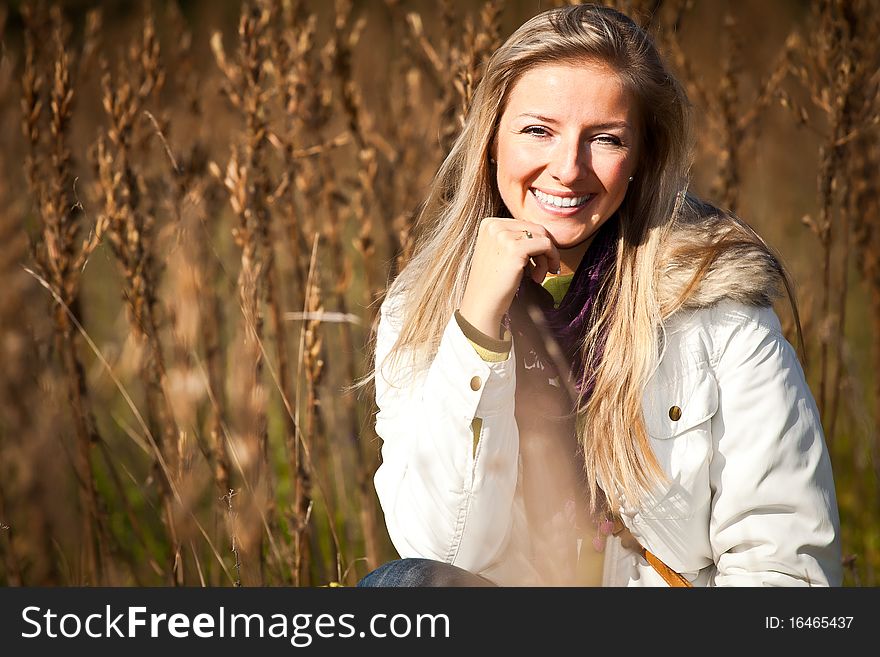 Caucasian young adult blond woman outdoor fall time