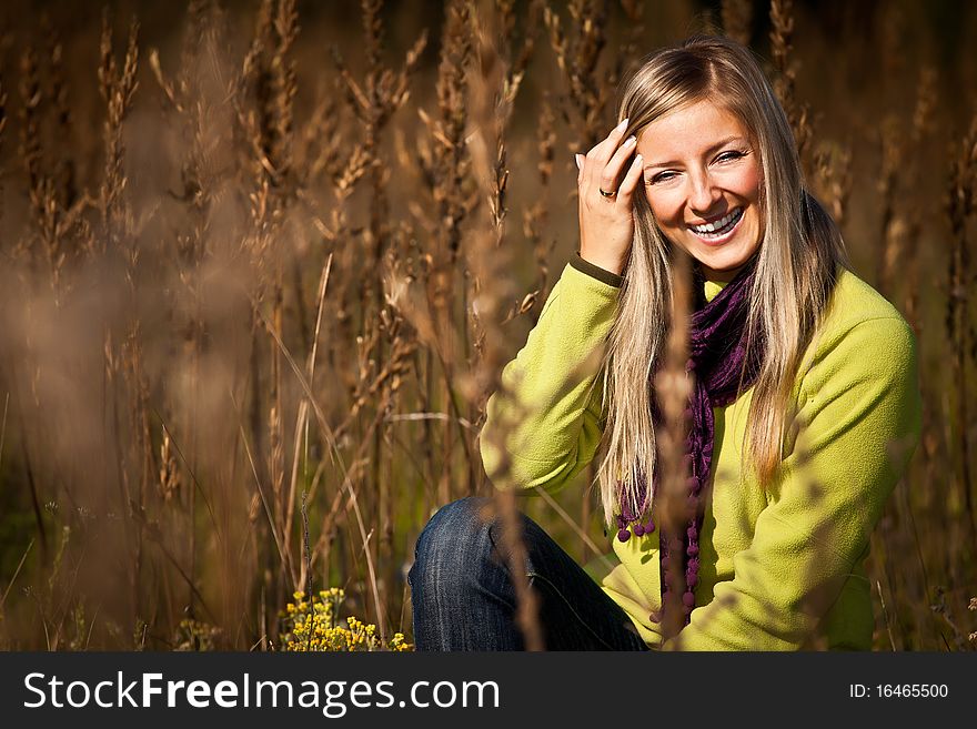 Caucasian young adult blond woman outdoor fall time