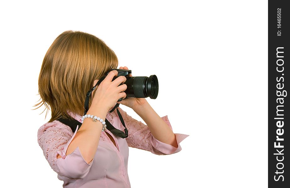 Girl on a white background, holding a camera in his hands. Girl on a white background, holding a camera in his hands