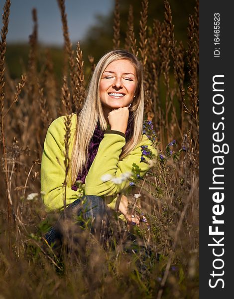 Caucasian young adult blond woman outdoor fall time