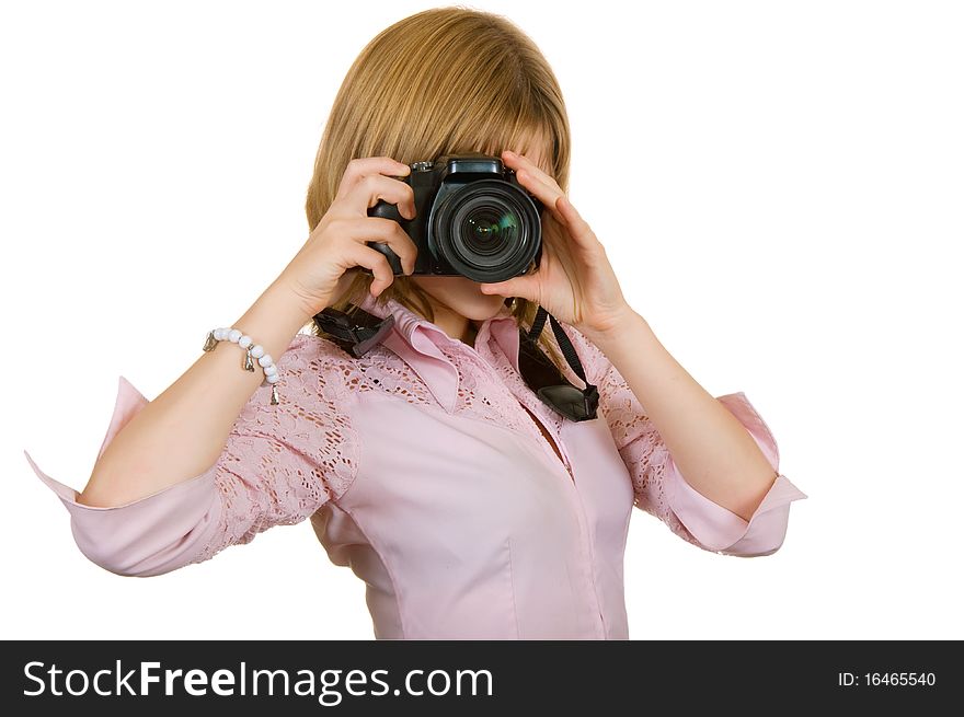 Girl on a white background, holding a camera in his hands. Girl on a white background, holding a camera in his hands