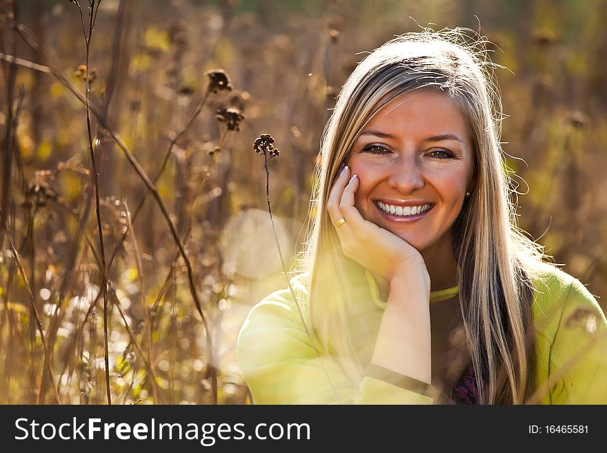 Caucasian young adult blond woman outdoor fall time