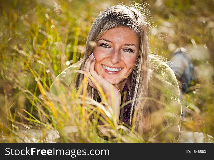 Caucasian young adult blond woman outdoor fall time