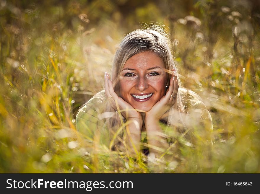 Caucasian young adult blond woman outdoor fall time