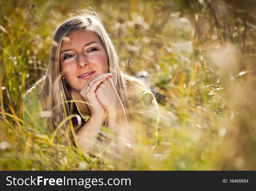 Caucasian young adult blond woman outdoor fall time