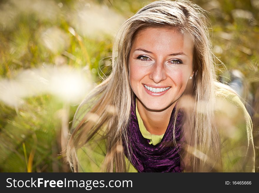 Caucasian young adult blond woman outdoor fall time