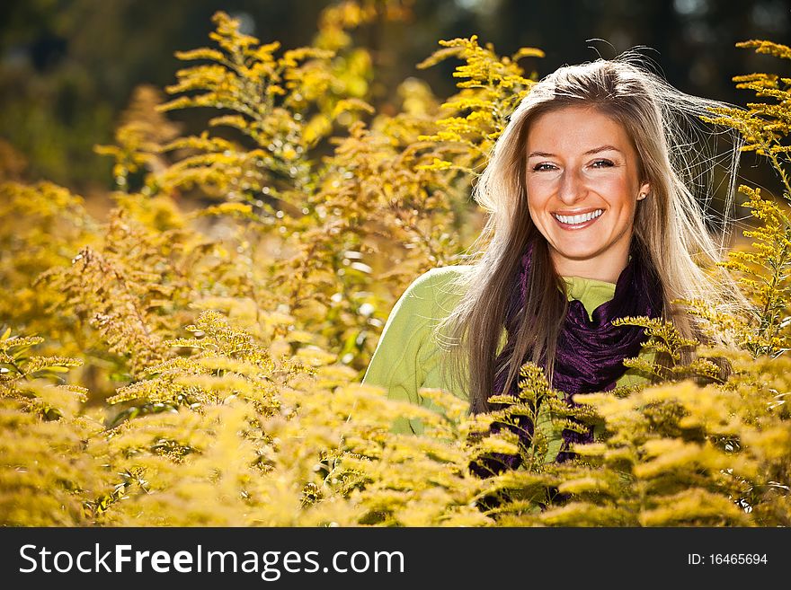 Caucasian young adult blond woman outdoor fall time