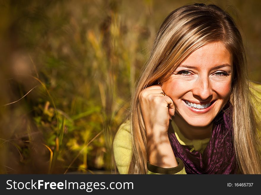 Caucasian young adult blond woman outdoor fall time