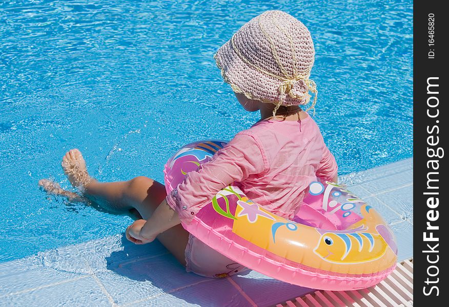 Little Girl With Inflatable Circle At Pool