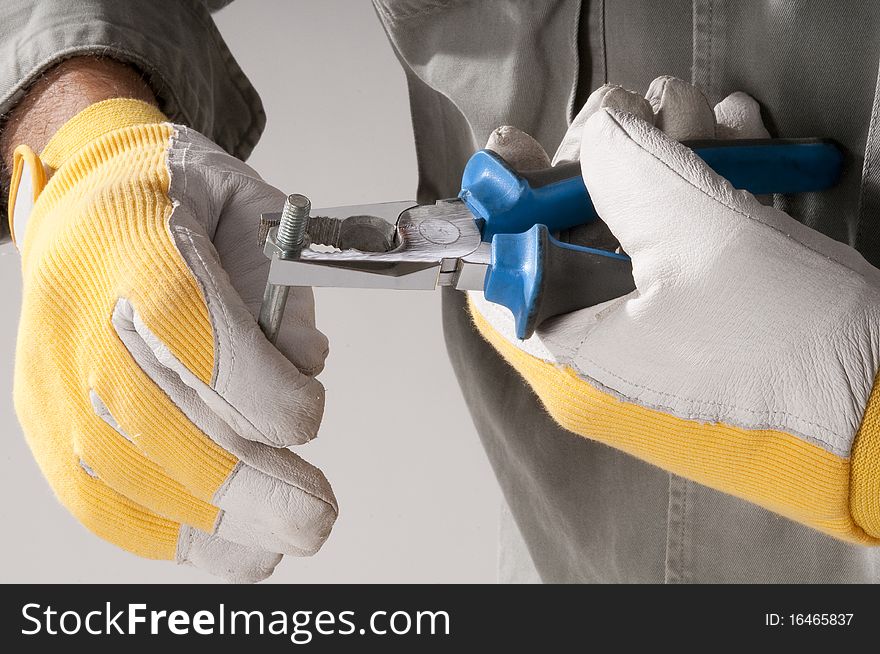 Man hand using pliers with gloves