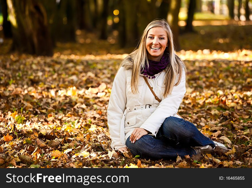 Caucasian young adult blond woman outdoor fall time