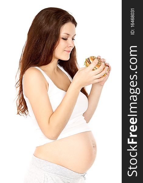 Pregnant woman eats a sandwich. Pregnant woman eats a sandwich