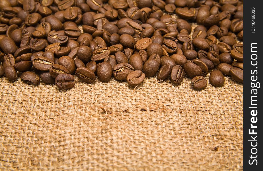 Grains of coffee on a background rough material