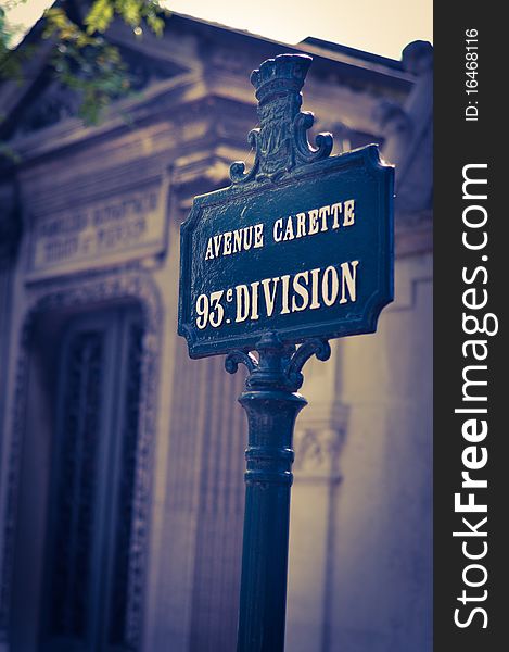 Close up photo of the Avenue Carette sign at Pere Lachaise Cemetary in Paris