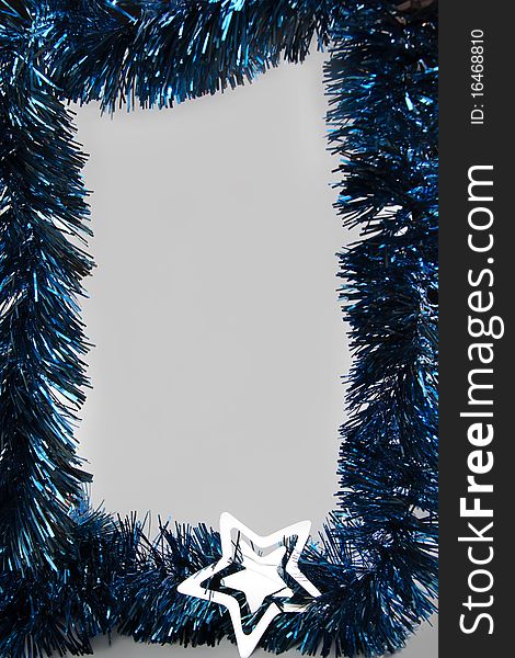 Blue Christmas ornaments frame with silver star and light-gray background