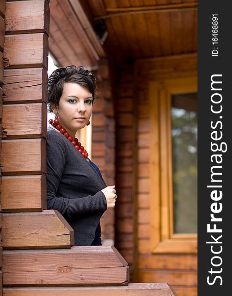 Girl standing on a veranda. Girl standing on a veranda