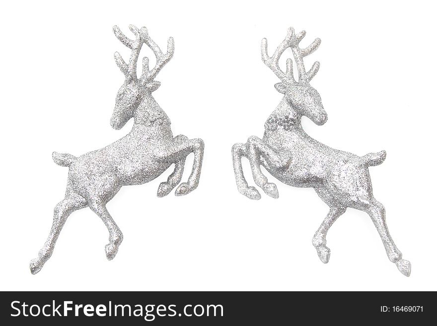 Christmas ornaments - two figures of glittering deer isolated on white. Christmas ornaments - two figures of glittering deer isolated on white