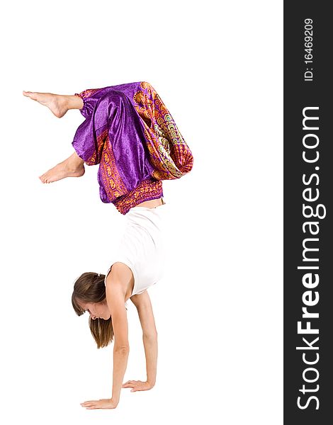 Girl in ethnic clothes standing on hands