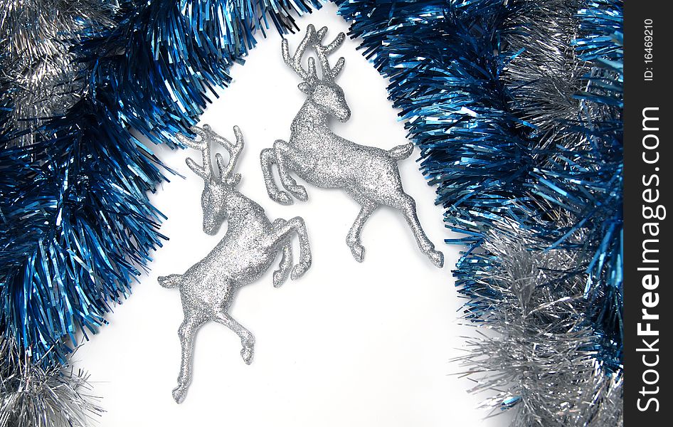 Christmas decorations with tinsels and silver deer. Christmas decorations with tinsels and silver deer