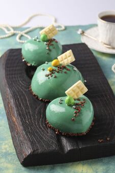 Homemade Bright Mousse Cakes Hearts With Green Mirror Icing, Vertical Orientation Stock Images Homemade Bright Mousse Cakes Hearts With Green Mirror Icing, Vertical Orientation Stock Images
