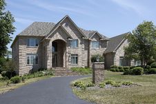 Large Brick Home With Arched Entry Stock Photos