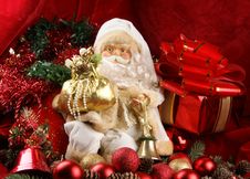 A Toy Santa Claus On A Background With Red Ribbons Royalty Free Stock Photo A Toy Santa Claus On A Background With Red Ribbons Royalty Free Stock Photo