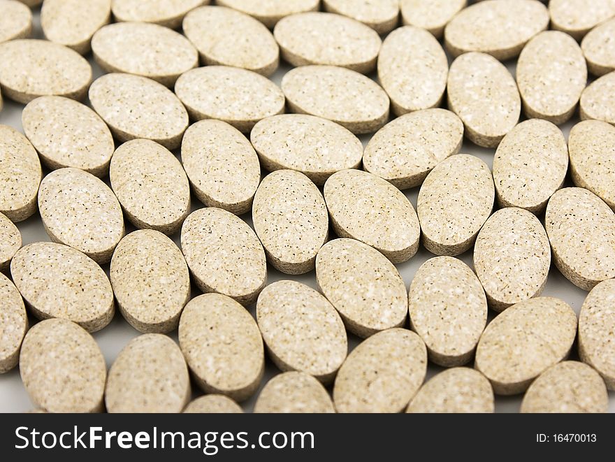 Heap of grassy tablets on a white background it is isolated