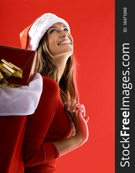 Cheerful Santa Girl carrying gifts