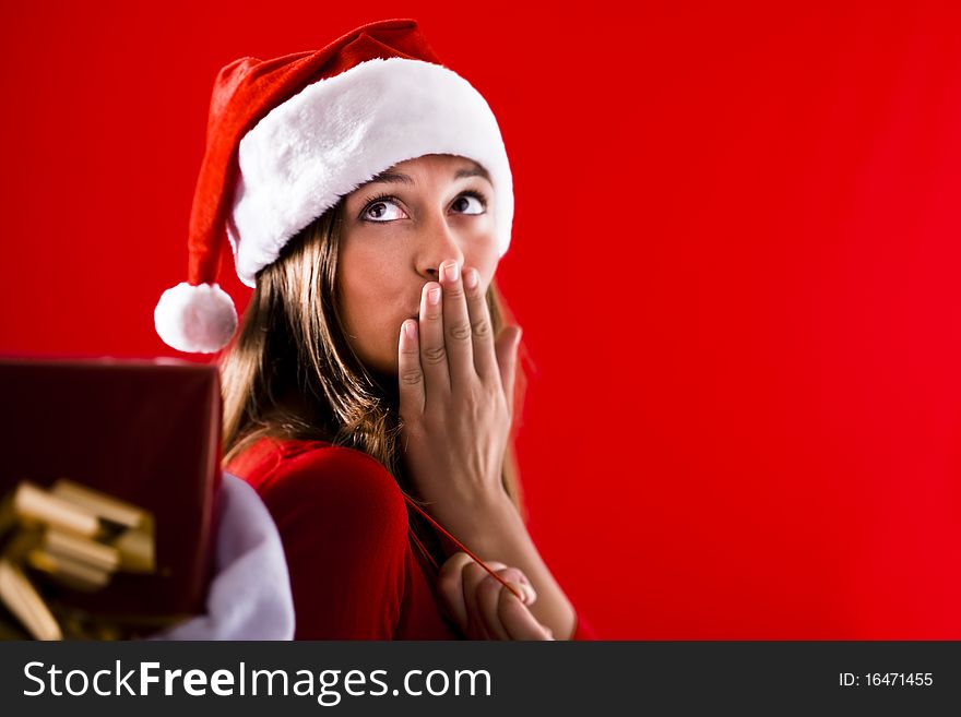 Beautiful Santa Girl sending kiss, lots of copy-space