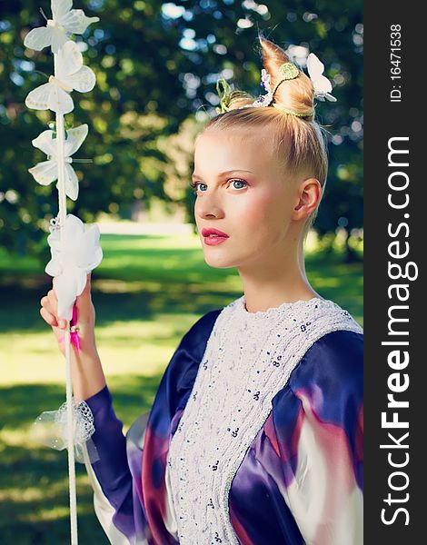 Beauty outdoor portrait with defocused forest background