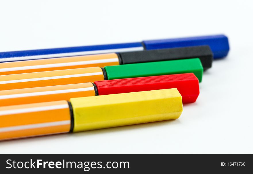 Colorful pens on a white background