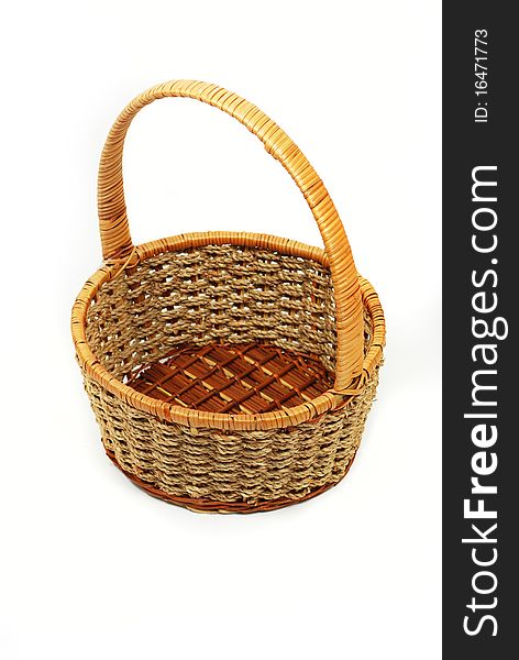 A polished basket made out of twigs. A polished basket made out of twigs